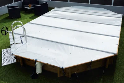 A woodstar swimming pool cover.