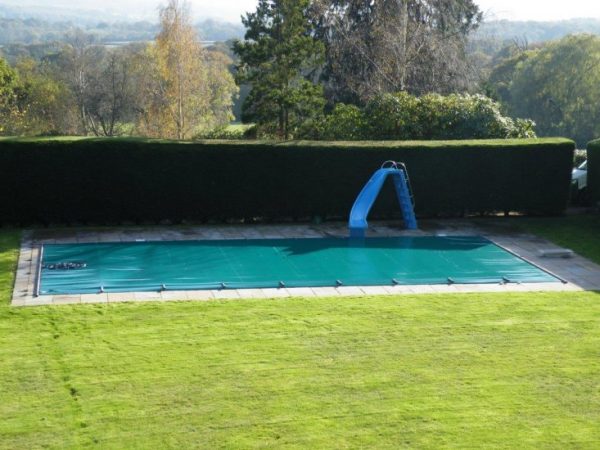 Swimming pool safety cover.