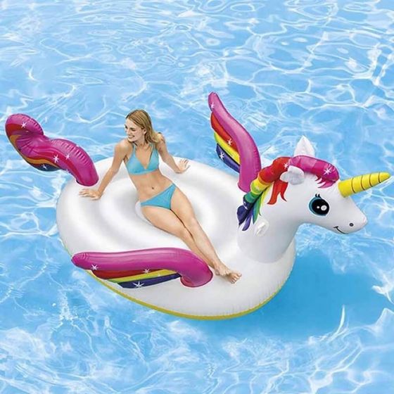 An inflatable unicorn floating in a swimming pool.