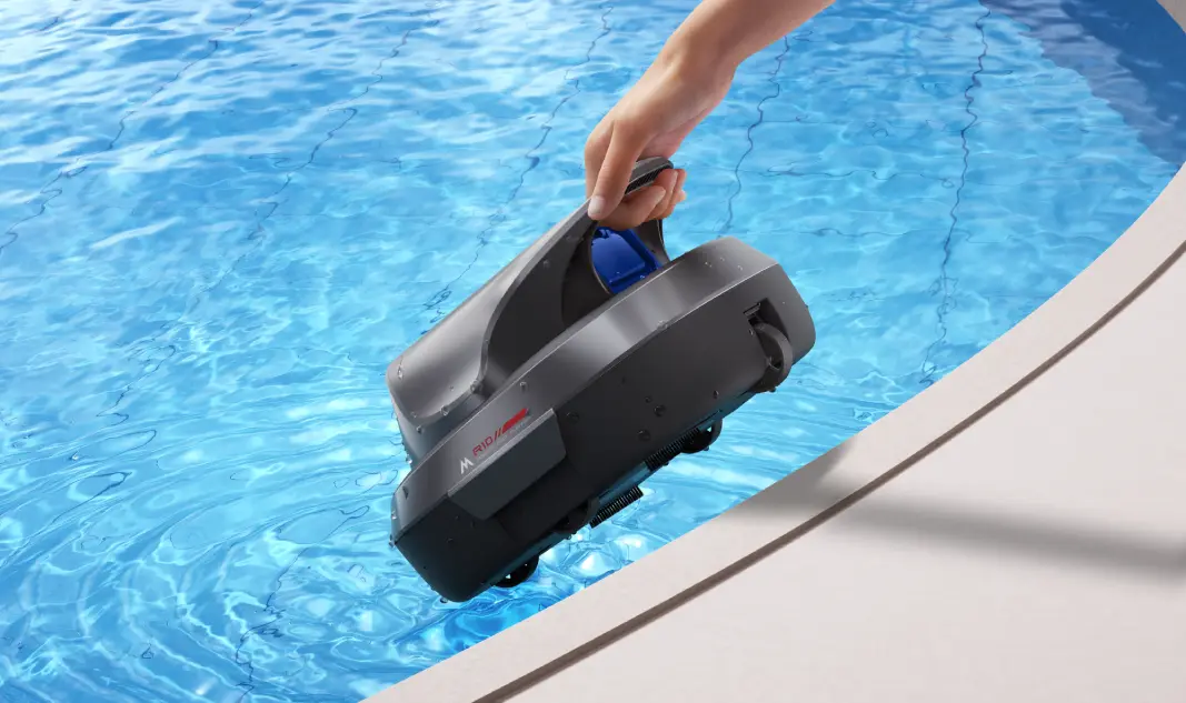 the mova r10 being picked up out of a swimming pool by its handle.